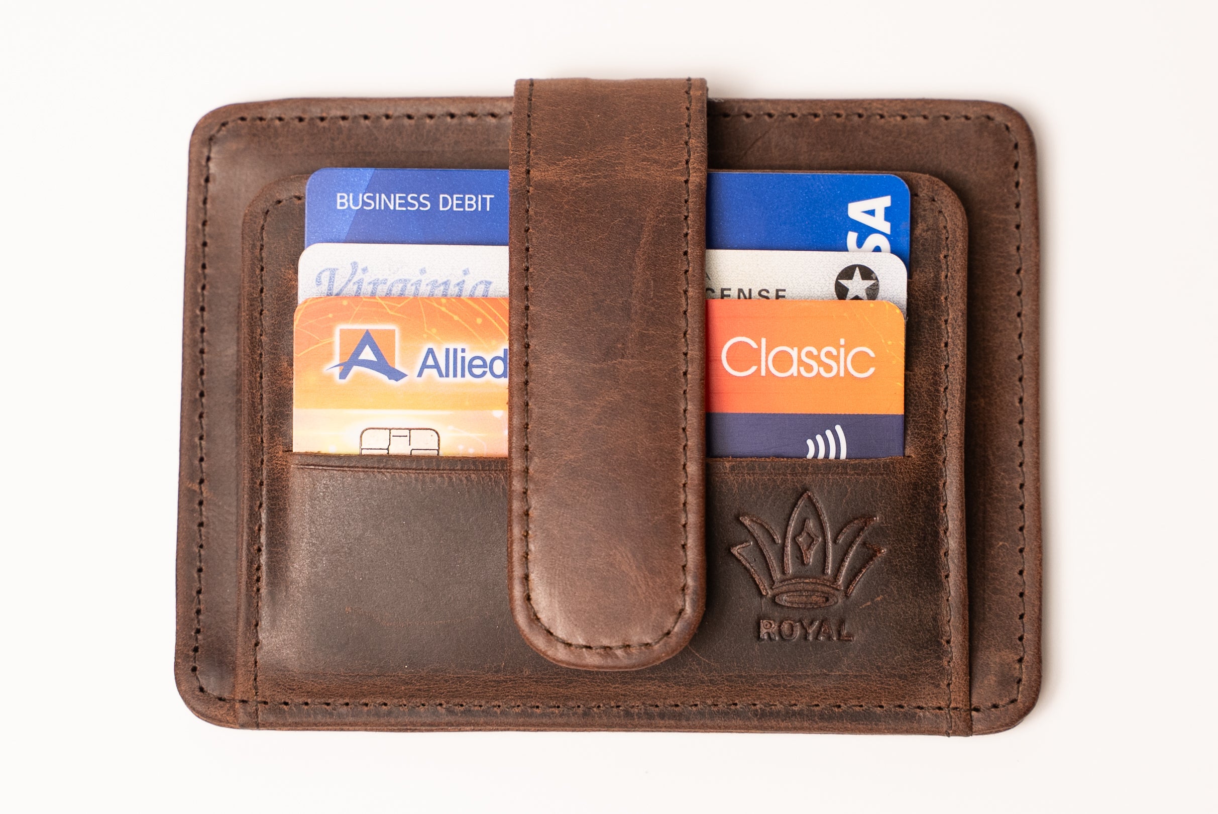 Brown leather wallet with cards inserted on a white background