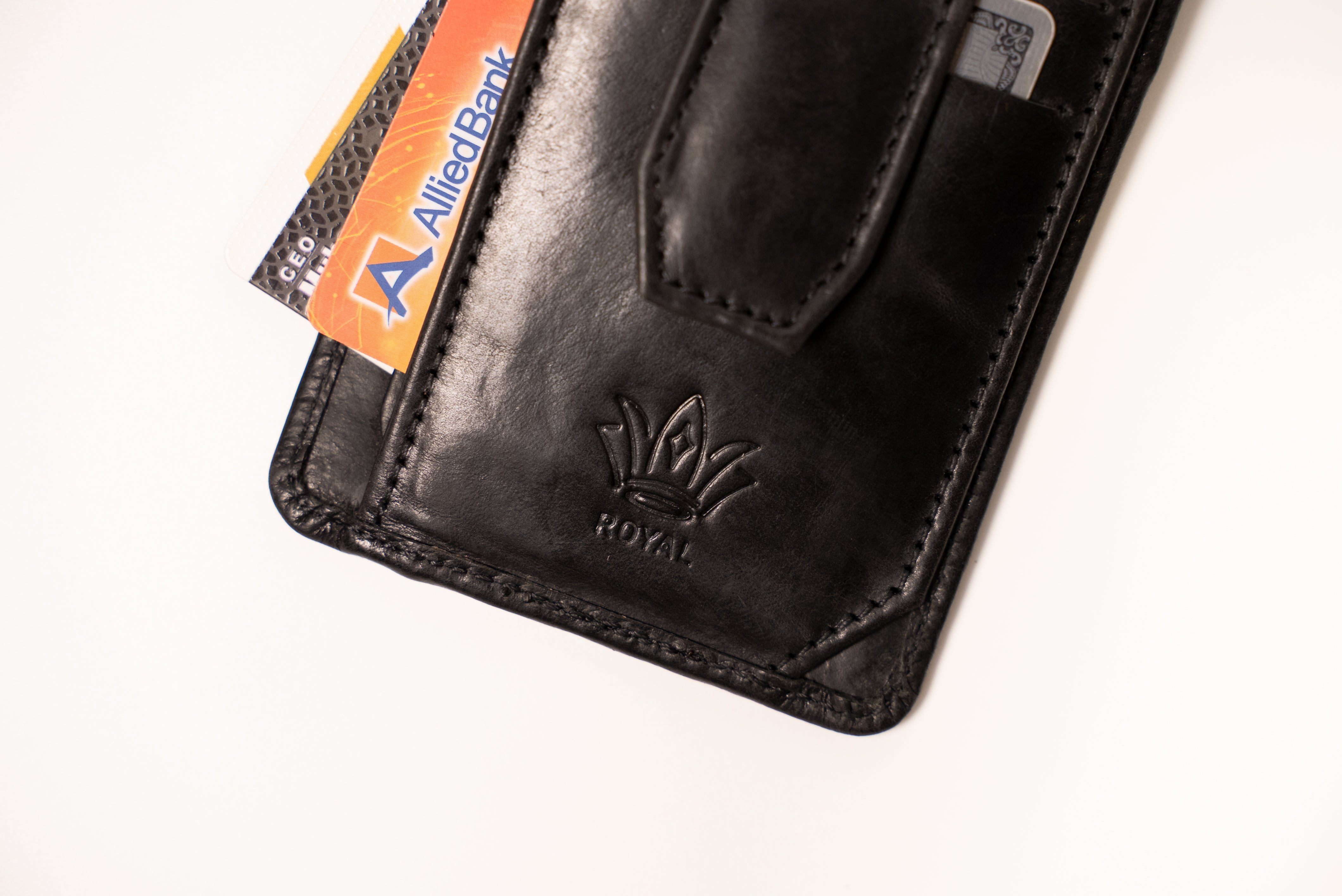 Black leather wallet with a card slot on a white background