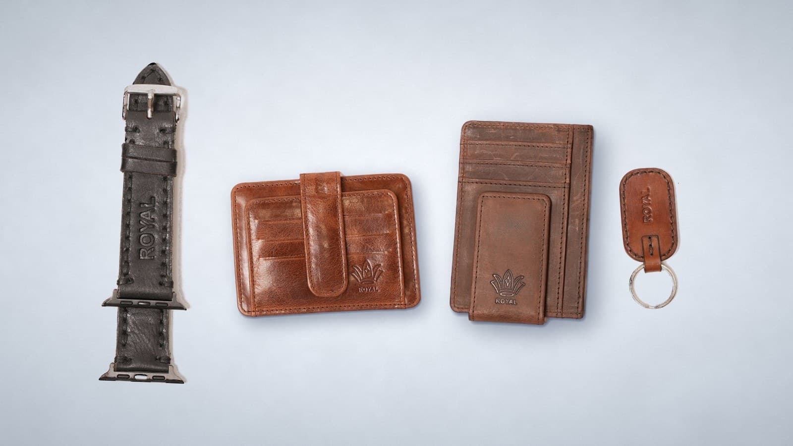 ROYAL leather gifts under $50: a black watch strap, a cognac card holder, a brown front pocket wallet and a tan keychain