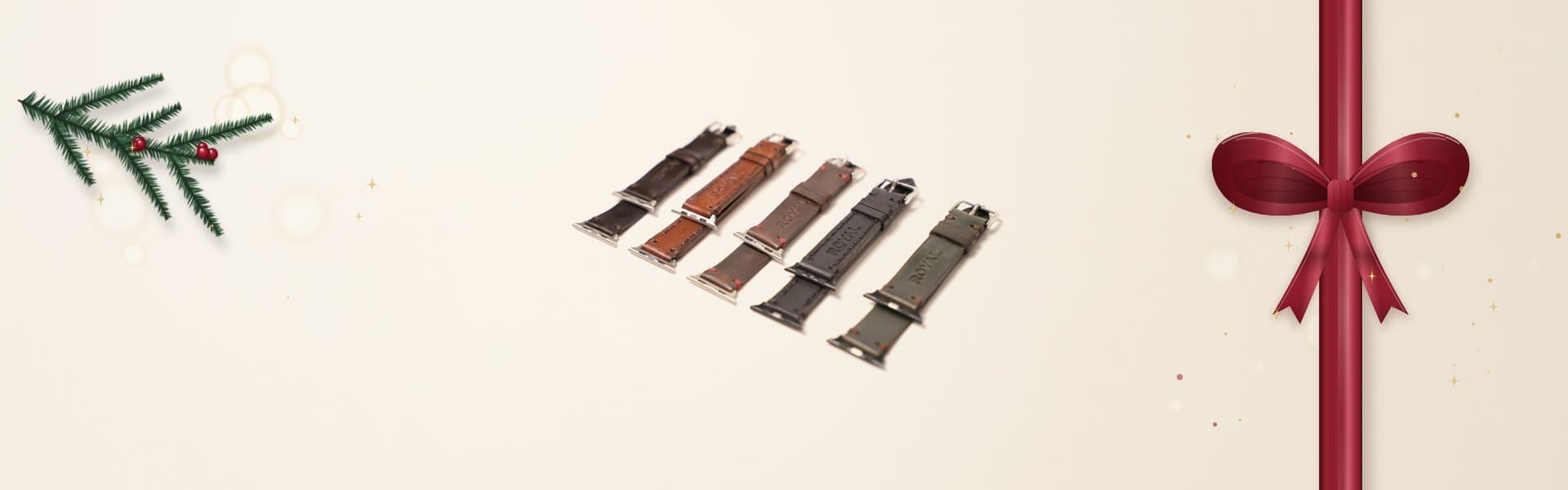 Five ROYAL leather Apple Watch bands in dark brown, tan, brown, black and olive laid out on a warm cream surface