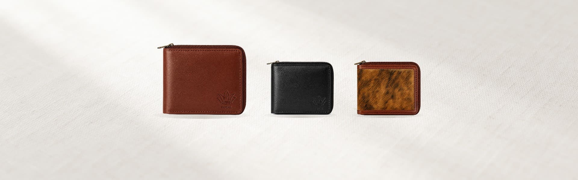 ROYAL full grain leather wallets on a warm oat linen backdrop