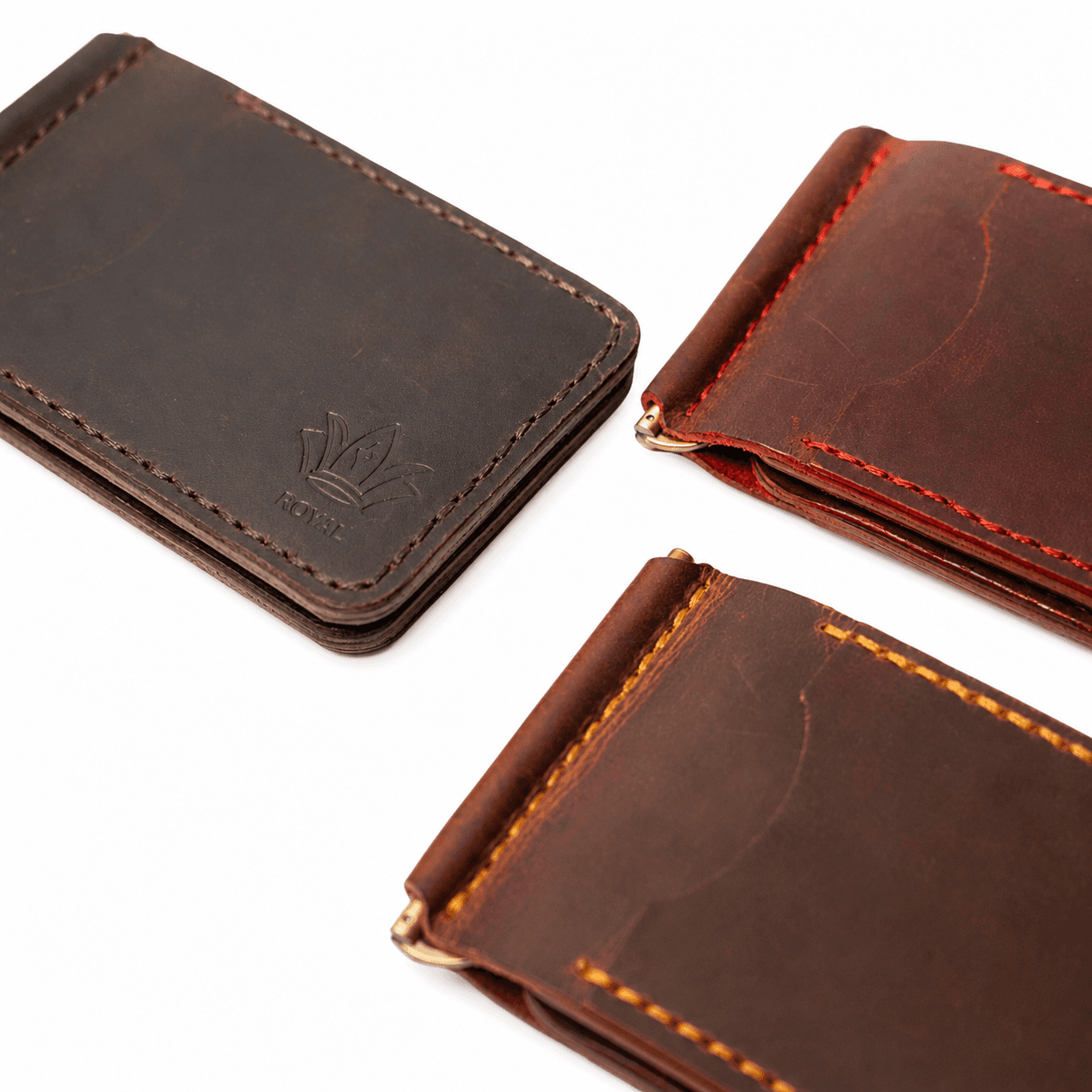 Burgundy and brown money clip wallets side by side showing both colours